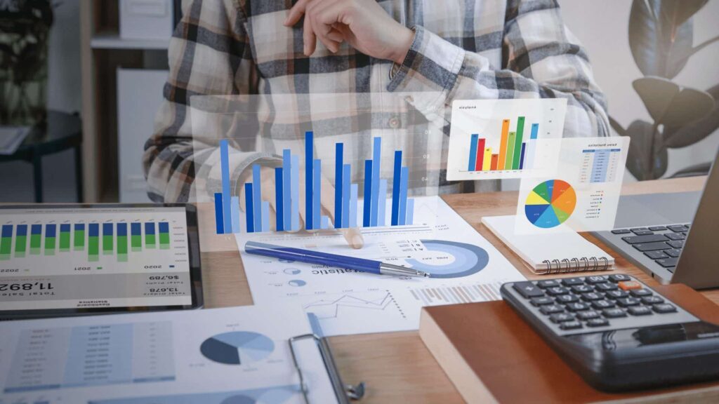 multisite certification - a calculator and series of graphs on a table