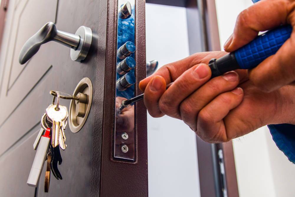 Amtivo (Formerly Certification Europe and EQA) - Locksmith Certification - A locksmith installing or repairing a door lock