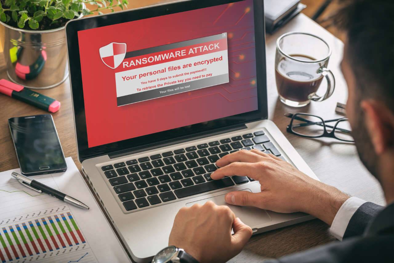 what is ransomware - person with encrypted laptop and data